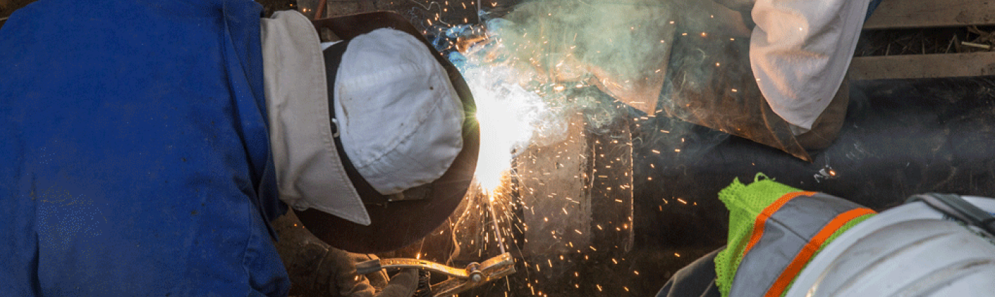 Workers welding